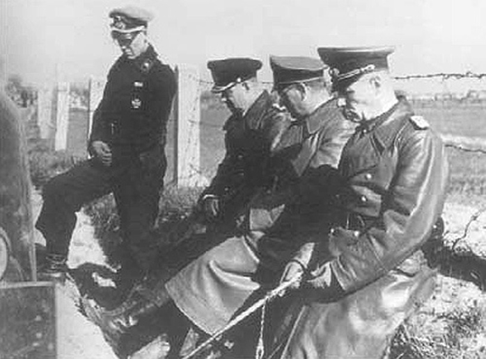 Rommel (right) with his closest staff members, his Chief of Staff, General Hans Speidel (centre), Chief Naval Aide, Admiral Friedrich Ruge (left), and his personal aide, Captain Helmuth Lang (standing). All of them were heavily involved in the anti-Nazi conspiracy within the Wehrmacht. Picture, May 1944.